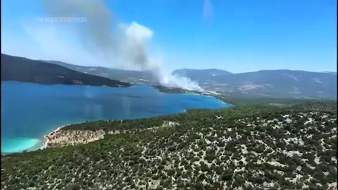 Firefighter helicopters and planes deployed to contain wildfires in western Turkey