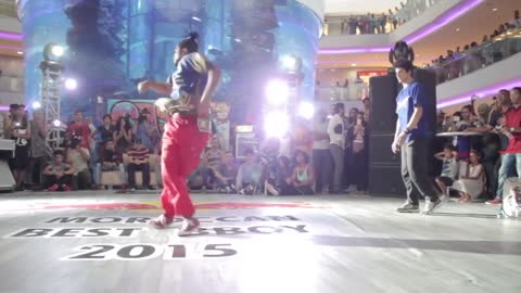 Two Guys Show Off Their Impressive Dance Moves Amidst Crowd During Dance Face-Off