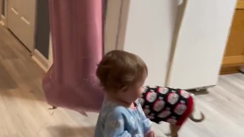 cute baby playing big doll