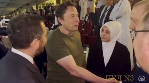 Elon Musk Shares a Very, VERY Long Handshake with Turkish President