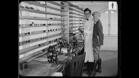 Albert Austin pretending to be a film editor at Chaplin Studios