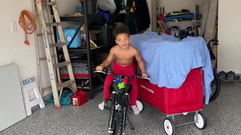 Son Listening to Dad is Oblivious to Dirt Bike Christmas Present