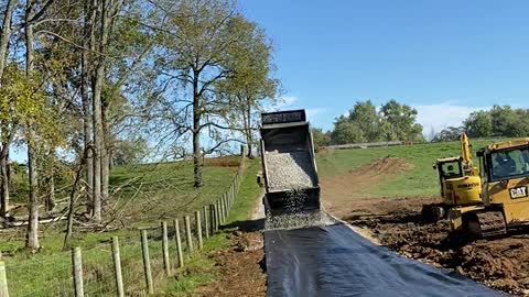 Dump Truck Back Spreading Gravel