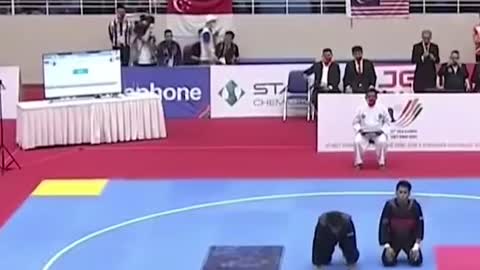 Silat competitors perform"sujud syukur" aftersemi-final match