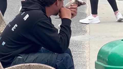 Homeless Man Eats A Rat