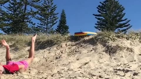 Collab copyright protection - two blonde kids face plant sand dune