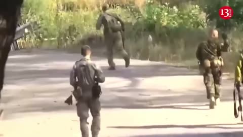 Footage of Ukrainian soldiers advancing with equipment and breaking through defense line in Kursk