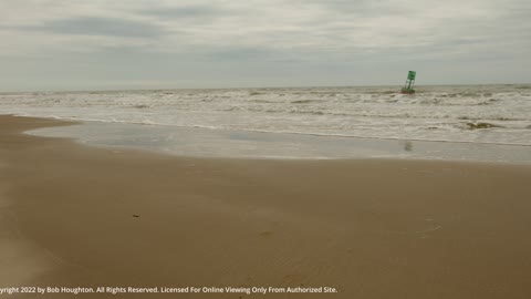 Relaxing Day at the Beach with Buoy Just Offshore