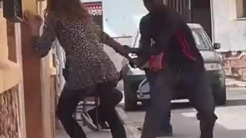 Black Migrant Attacking Spanish Lady While People Watch