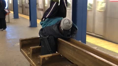 Red shoe guy does ab workout situps on wood subway bench