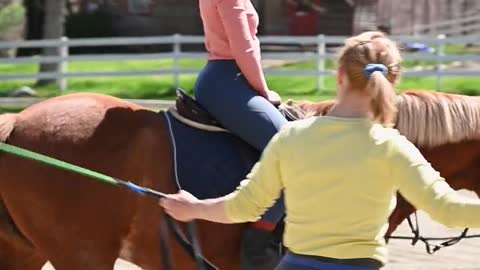 woman riding a horse