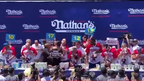 Protestor Gets DESTROYED While Interrupting Hot Dog Eating Contest