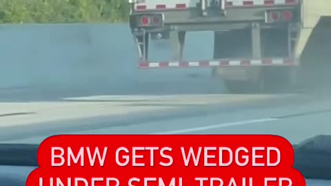 Michigan: A BMW was wedged underneath a semi after a crash on