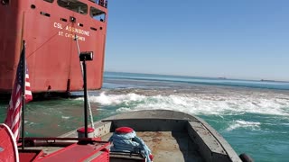 Great Lakes Tug Massachusetts spinning the saltie CSL Assinboine