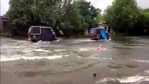 British Swimming on Busy Indian Road