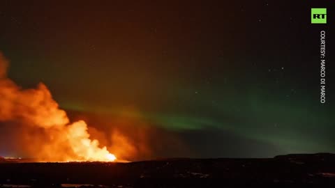 "NORTHern lights shine over erupting volcano in Iceland"