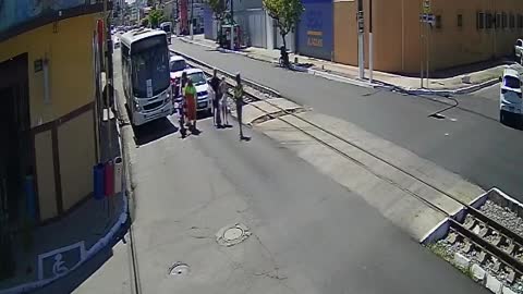 Biker Saves Old Lady Standing in the Tram Tracks