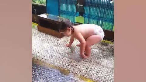 Funny Babies Playing with Water