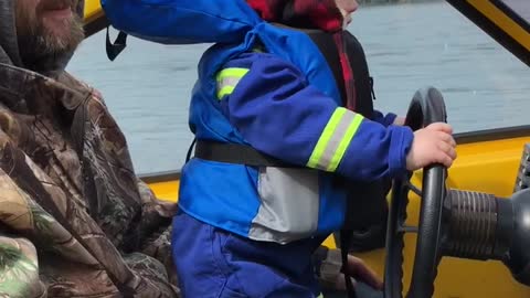 Tiny Tyke Enjoying First Boat Ride Of Spring