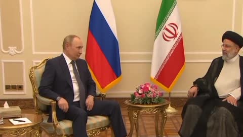 Screens from Vladimir Putin's meeting with his Iranian counterpart Ebrahim Raisi