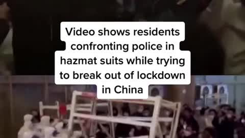 Video shows residents confronting police in hazmat suits while trying to break out of lockdown