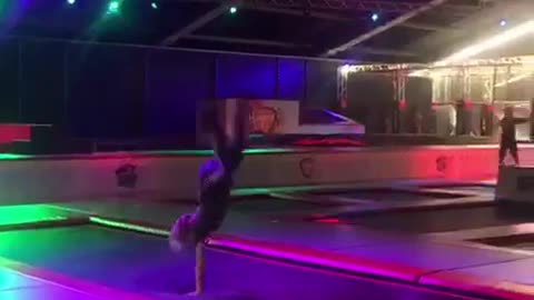 Kid back flip trampoline lit up disco lights