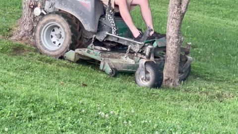 Lawnmowing Man Gets Stuck Between Trees