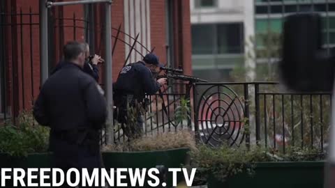 NYPD Officers are aim sniper rifles at the suspect from tactical locations around the United Nations building