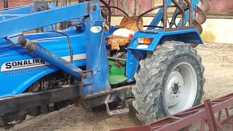 Tractor driving a cat