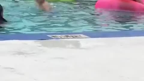 Woman shaving her legs at a swimming pool