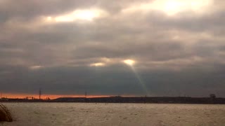 Rays of light make their way through the clouds.