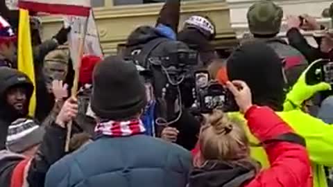 Trump Supporters pulling Antifa terrorists away from Capitol building