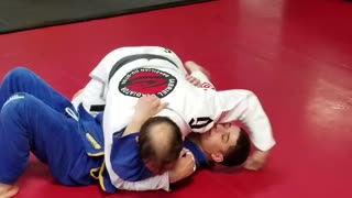 Bread cutter choke, to armbar