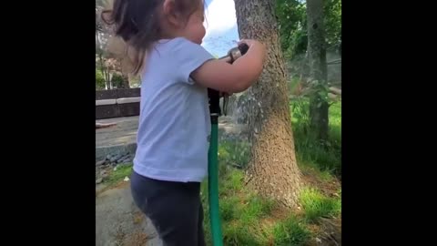 Toddler tries to catch water