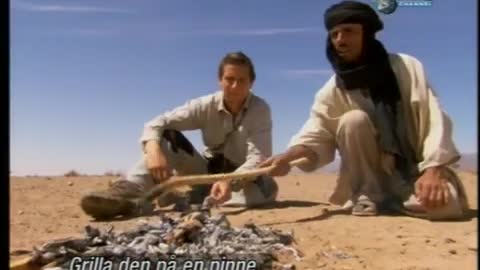 Bear Grylls eating vipersnake in Africa