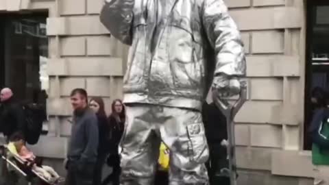 The street mime hung in the air, astonishing millions of people. London, Great Britain.