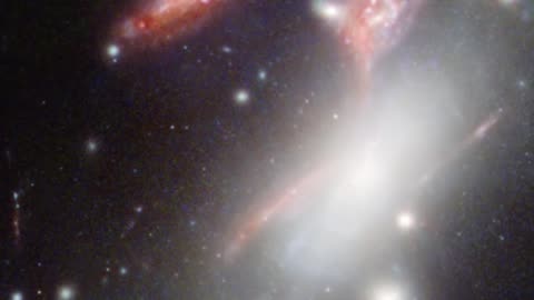 Mind-Blowing_ NASA's Webb Spots a Question Mark-Shaped Galaxy Cluster