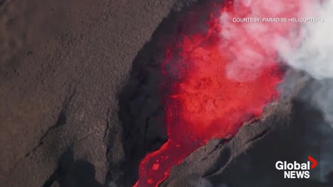 Mauna Loa volcano spews lava, gas and ash into sky as eruption continues