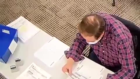 PA Poll Worker fills out ballots