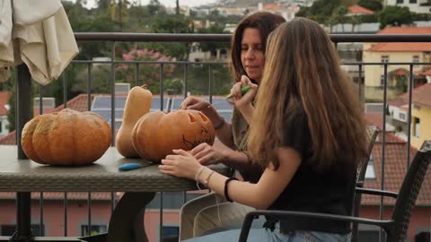 Girl carving pumpkins