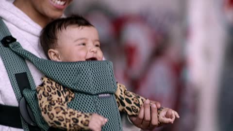 Beautiful mom carry her cute baby