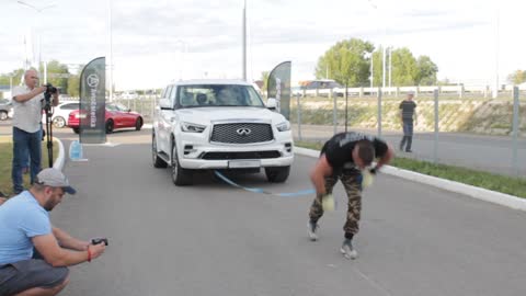 Guy Pulls Car While Doing Handstand