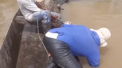 Men Battle Monster Fish