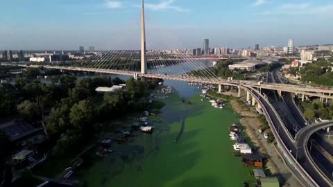 Heatwave-fueled algae bloom turns Serbian river green