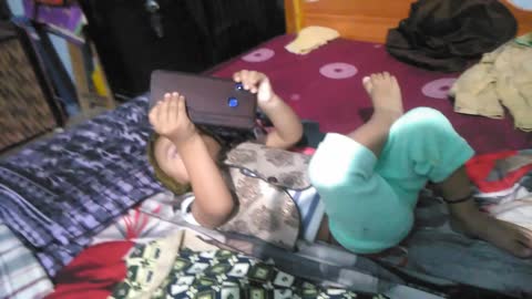 Cute kid playing with mobile369