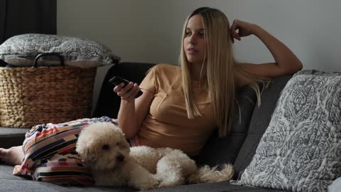 Girl Watching TV With Dog