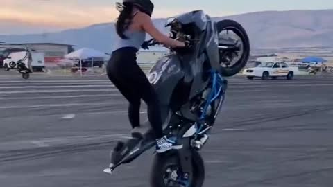 Girl bike stunt