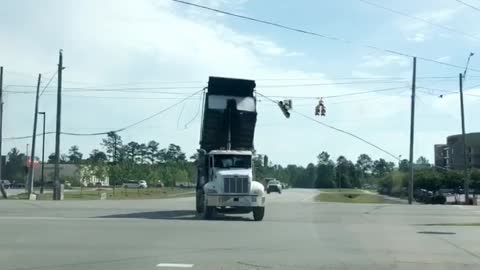 Raised Truck-Bed Takes out Traffic Lights