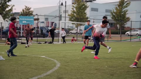 Group Of Boys Plays Soccer In A Soccer Field