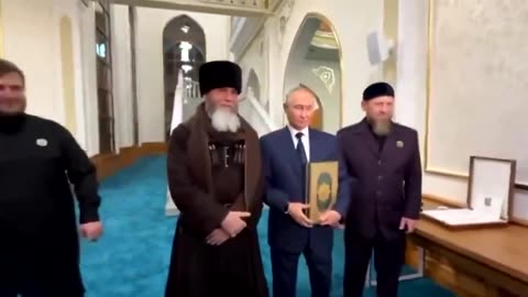 Russian President Putin kisses the Quran